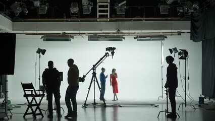 Professional filming pavilion with a white cyclorama. The process of preparing for the shooting of...