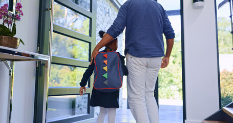 Father, child and back to school at door, walking in home and leave to start learning. Dad, kid and girl with backpack for first day, education or care, support of student with bag and hands together - obrazy, fototapety, plakaty