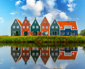 Volendam town in Holland. Beautiful colored houses in Volendam. - obrazy, fototapety, plakaty