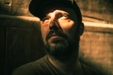 portrait of a man with a wood background