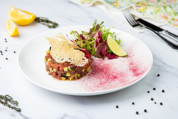meat salad with arugula and lime, side view