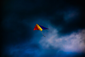 Colorful kite in a cloudy sky