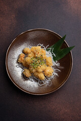 shrimp popcorn and microgreen on a plate