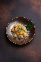 shrimp popcorn and microgreen on a plate