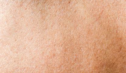 Healthy tanned human skin background texture, beautiful abstract close-up.