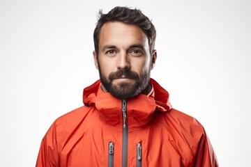 Obraz premium Portrait of a content man in his 30s wearing a functional windbreaker against a white background. AI Generation