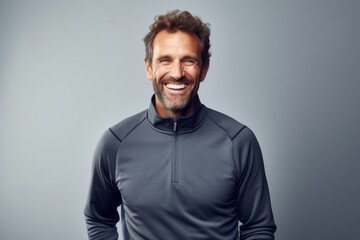 Obraz premium Portrait of a happy man in his 30s wearing a thermal fleece pullover against a white background. AI Generation