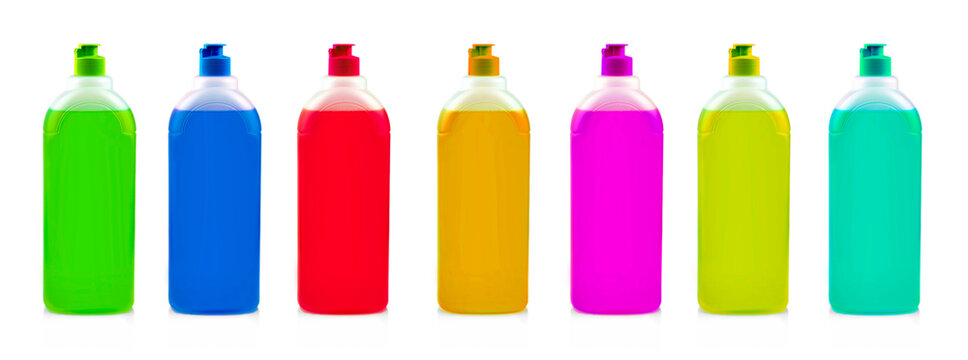 Set of colored bottles with dishwashing detergent on white background