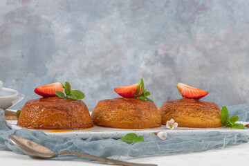Caramel custard pudding  on plate over modern background with copy space.