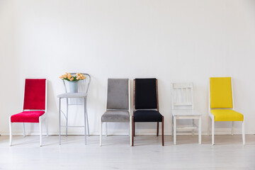yellow red grey black white chairs with flowers on white background interior