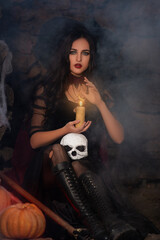 A portrait of a young sexy witch with outside. Magic, dark force, spell. Witchcraft. Halloween.