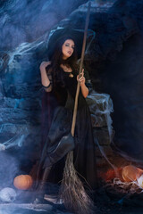 A portrait of a young sexy witch with outside. Magic, dark force, spell. Witchcraft. Halloween.