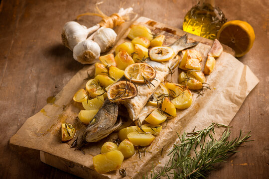 oven sea bass with potaoes lemon and rosemary