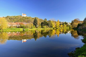 Fototapeta premium Dolní Kounice - Czech Republic. Beautiful autumn landscape with forest, sky, clouds and sun in the sky. Nature in autumn.