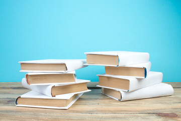 open book, books on the blue background. Back to school. Education. Copy space for text.