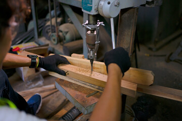 Trainee works at machine shop.