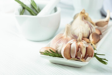 Fresh garlic bulbs with rosemary.