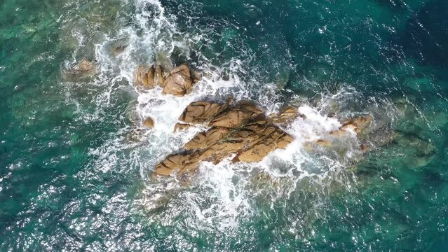 Splashing waves in the Mediterranean Sea. Beautiful natural sea in Sardinia, Italy.