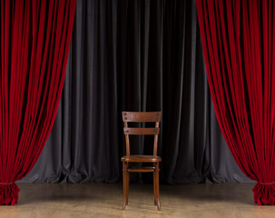 Vintage wooden chair in show stage. Chair on empty stage with red curtains