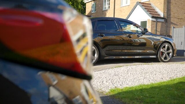Shiny black car after a full detail