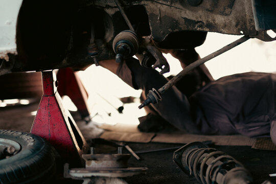 Busy Mechanic Shop in Action - Industrial Automotive Workshop Photography