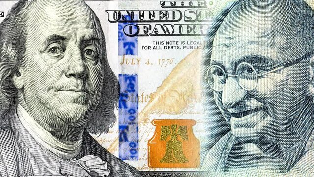 Benjamin Franklin's portrait is replaced by a portrait of Mohatma Gandhi. Business concept of the exchange rate, stock exchange, trading
