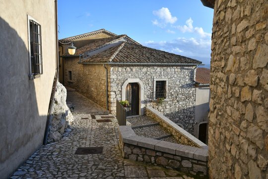 A narrow street between the old houses of Gesualdo, a medieval village in Campania, Italy.