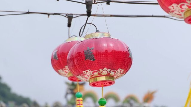 Traditional Chinese red lanterns hang in front of the old heritage Taoist Temple during the Lunar New Year Festival.