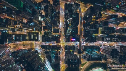 Top View Hyperlapse of Traffic in Hong Kong City, Aerial view city streets at night, Establishing shot for Innovation technology and transportation Concept - Powered by Adobe