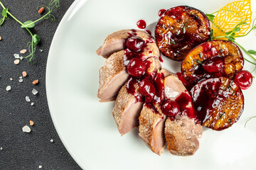 Baked duck fillet with plums. Food recipe background. Close up