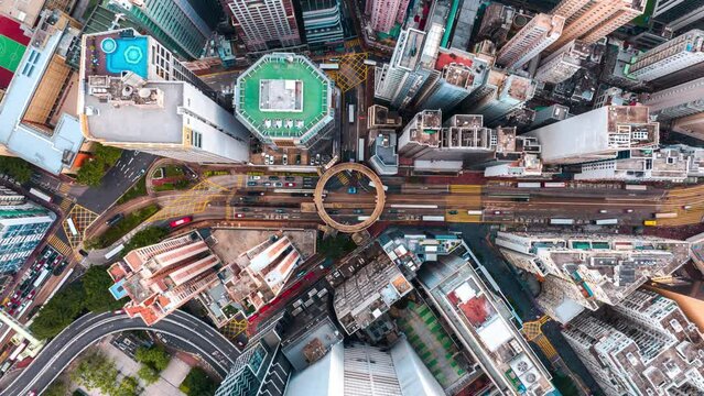 Top View Hyperlapse of Traffic in Hong Kong City, Aerial view city streets at roundabout, Establishing shot for Innovation technology and transportation Concept