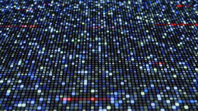 Large display of bytes encoded as hexadecimal characters.  Random strips of characters flash in red and fade.