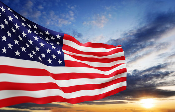 American flag over sky background.