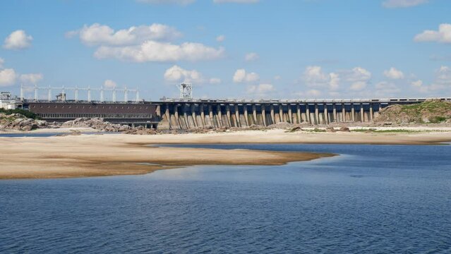 Sandbanks on the Dnieper against the backdrop of the Dnieper hydroelectric power station dam in Zaporizhia