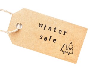 Brown tag with hole and rope and the Words winter sale on a white background 