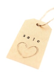 brown price tag with the word sale and a heart