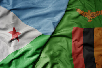 big waving national colorful flag of zambia and national flag of djibouti .