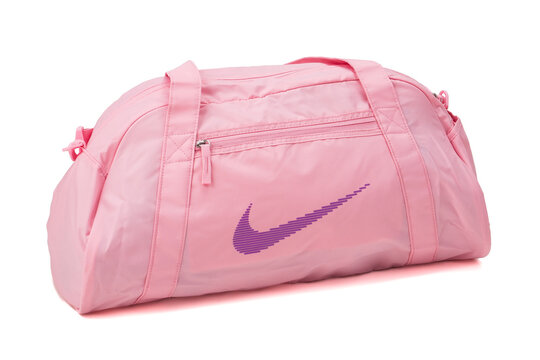 Udine Italy November 15, 2023. Nike brand pink sports bag. White background