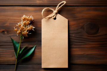 Paper bag with string on a wooden background. Mockup label for business mockups for handmade products