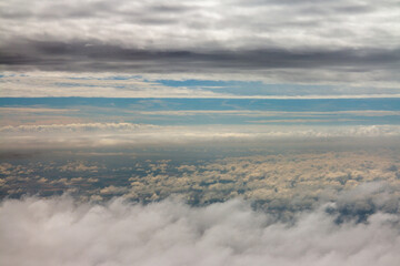 above the clouds, view above clouds from airplane window, flight, by airplane