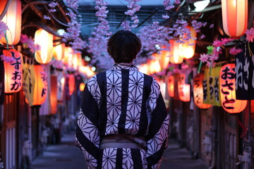 back view of kimono wearing man picture with beautiful night photography