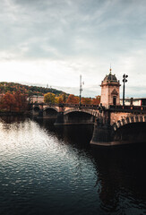 Legion Bridge in Prague (Czechia) on autumn sunset with Vltava river on foreground. Old town of Prague - famous Legion Bridge -  Cityscape of Prague on sunset.