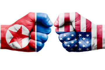 KOREA NORTH vs USA confrontation, religious conflict. Men's fists with painted flags of KOREA NORTH and USA.