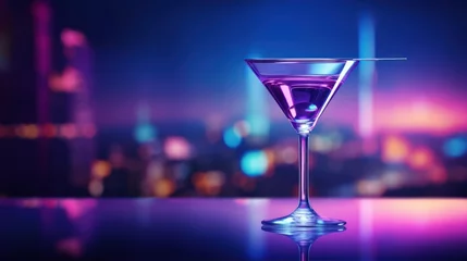Foto op Aluminium  a martini glass sitting on a table in front of a cityscape at night with a purple and blue hued light reflecting off of the top of the glass. © Anna
