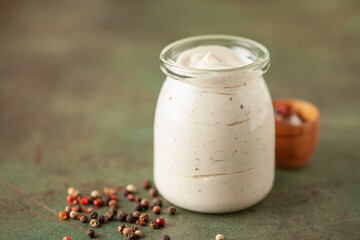 Alabama white BBQ sauce in bowl and ingredient for dip .