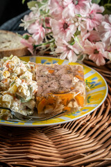 Jellied pork and beef with carrots served with vegetables salad