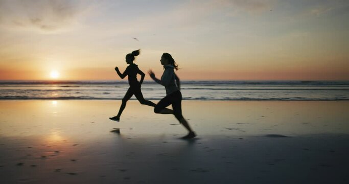 People, running and fitness on beach sunset for team workout, training and energy with cardio health. Women, sports friends or runner in race by ocean, sea or outdoor with exercise silhouette