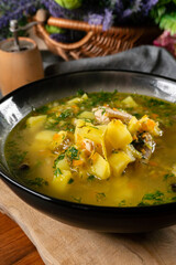 Cucumber soup in dark bowl.