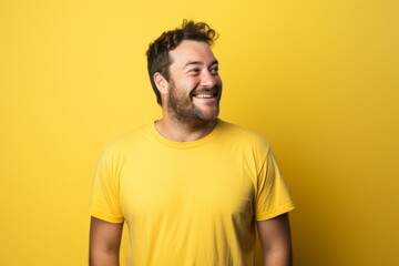 Portrait of a happy man in his 30s sporting a vintage band t-shirt against a pastel yellow background. AI Generation