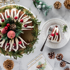 A decorated bundt cake for the holidays with one slice to the side.